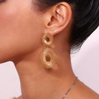 Boucles d'oreilles Solara – Boucles d'oreilles pendantes dorées en forme de soleil