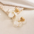 Boucles d'oreilles Liora Heart – Boucles d'oreilles romantiques avec cœur et fleur dorés